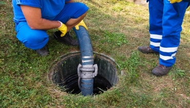 technician cleaning out pipe