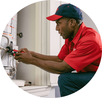 Mr. Rooter technician fixing hot water heater