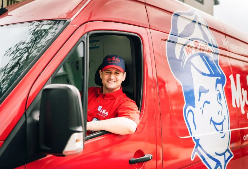 Mr. Rooter plumber ready to assist with commercial drain cleaning services. 