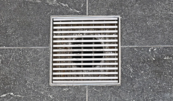 Drain on shower floor.