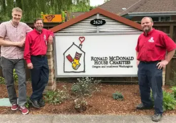 RMHC Director of Building Operations with Mr. Rooter Plumbing employees.