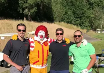 Mr. Rooter Plumbing employees with Ronald McDonald.