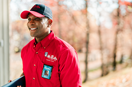 Close up portrait of Mr. Rooter professional wearing a red branded shirt.