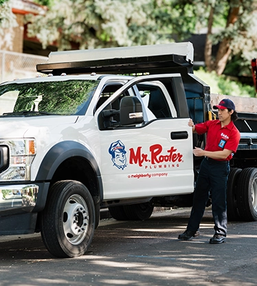 Mr. Rooter Plumbing white work truck.