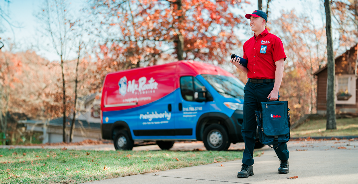 Mr. Rooter technician walking up to a customer's home.