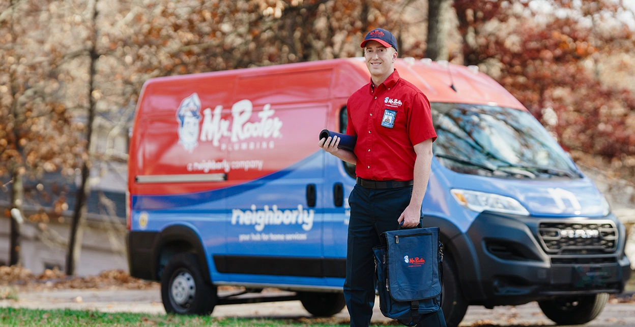 Mr. Rooter van parked on a residential street.