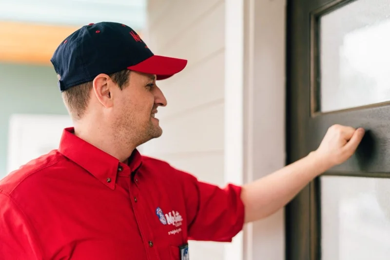 Mr. Rooter plumber arriving for plumbing service.