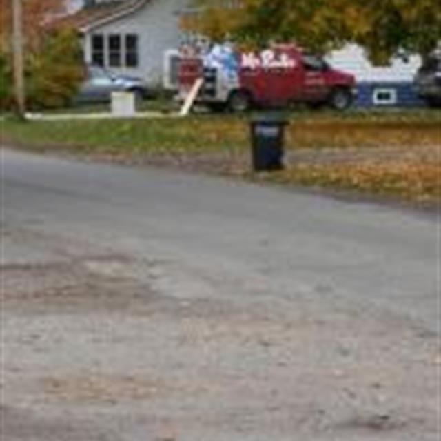 A Mr rooter van on a work site