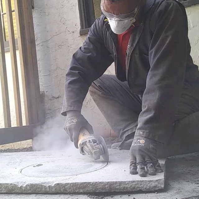 Omar, employee of Mr. Rooter of the Oakland-Berekley Area, cutting concrete.