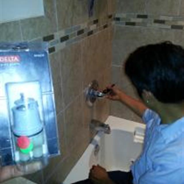 Service professional running shower water