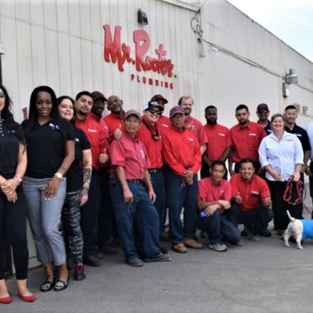 Team photo outside Mr. Rooter building