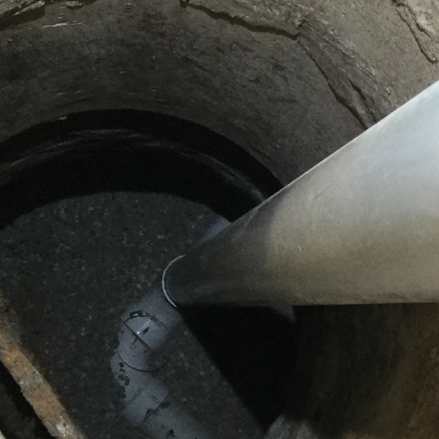 cement tunnel with pvc pipe going into it