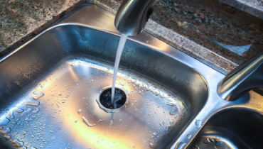 Image of a kitchen sink and a garbage disposal