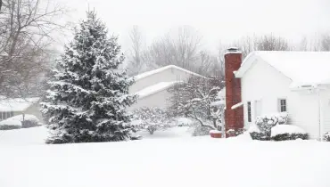 Homes in a suburban neighborhood blanketed. in snow. | Mr. Rooter Plumbing of South Jersey