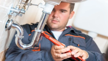 Plumber repairing drain | Mr. Rooter Plumbing of South Jersey