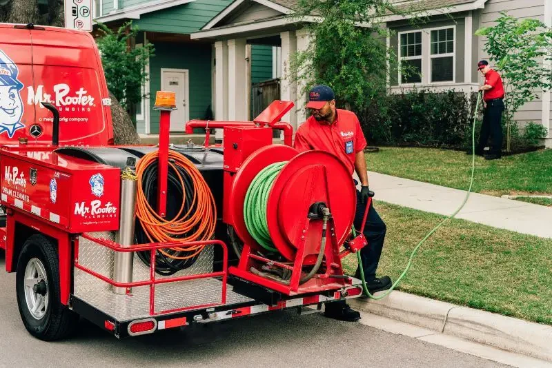 Mr. Rooter technicians getting ready to perform HydroScrub Jetting services