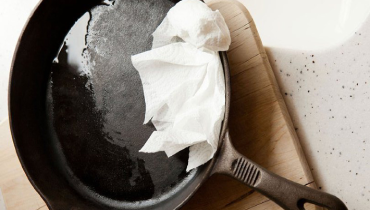 Grease in a castiron pan with a paper towel