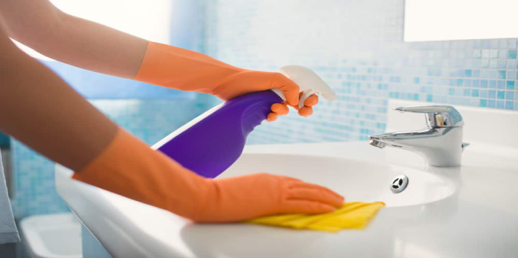 Cleaning a metal fixture in bathroom