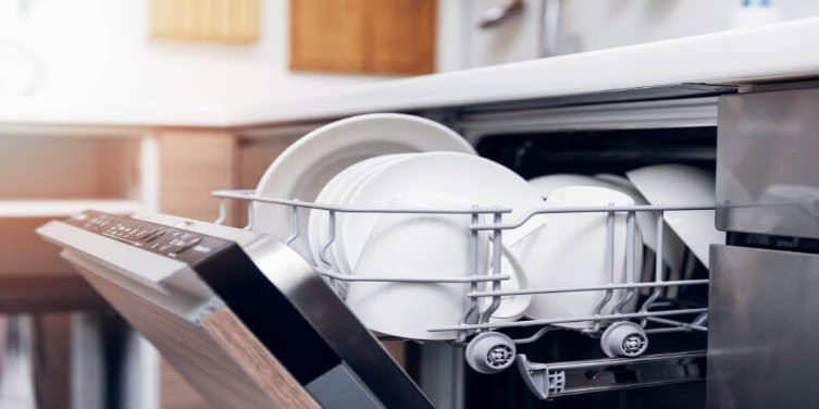 White dishes on the top shelf of an opening dishwasher