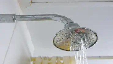 Close up of a partly clogged shower head in a bathroom | Mr. Rooter Plumbing of South Jersey