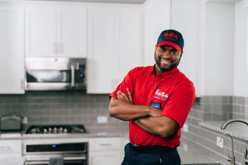 Mr. Rooter plumber ready to install tankless water heater