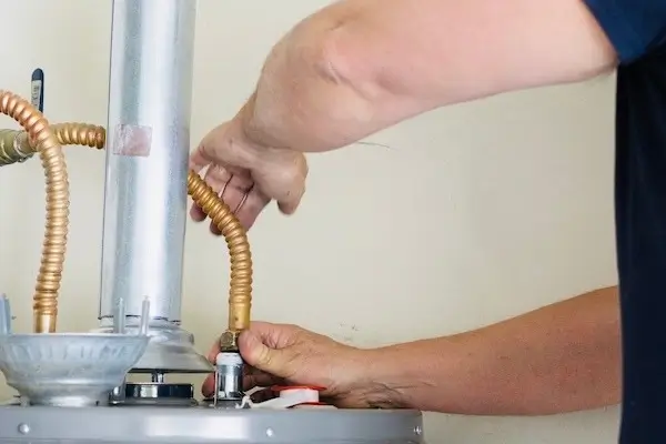 Plumber installs new residential water heater