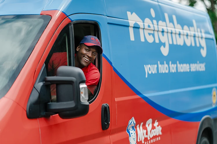 A Mr. Rooter plumber arriving to a job in Seattle, WA